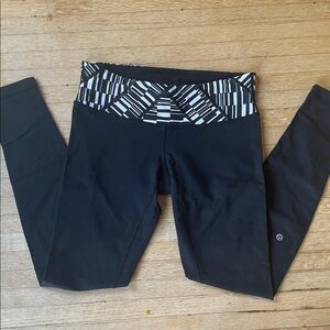 GUC Lululemon Black leggings with white and black striped waist band.